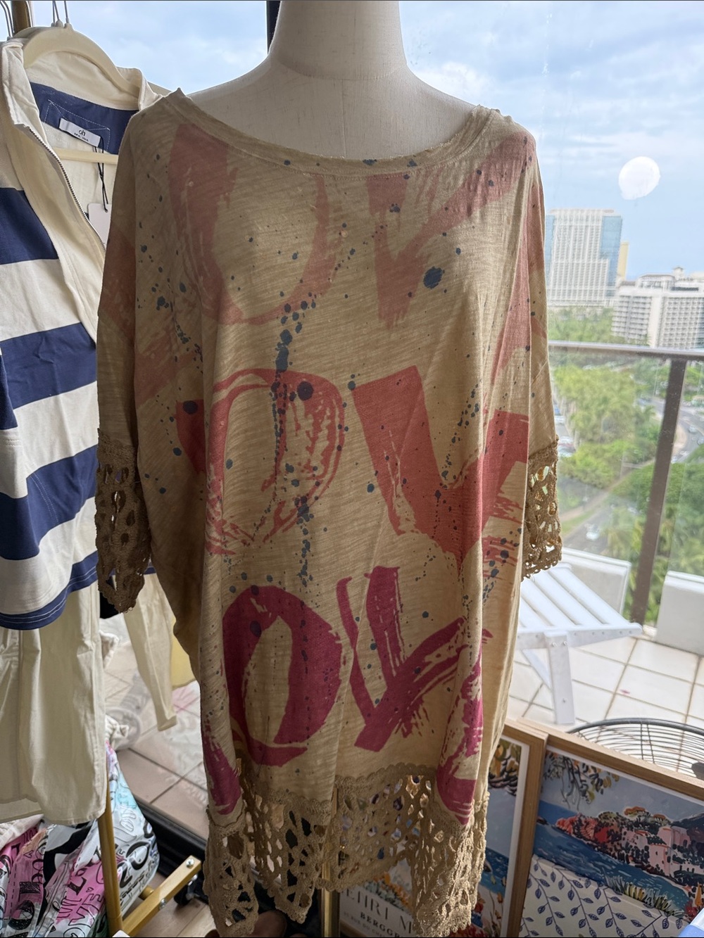 A Rare Bird Crochet-Hem Love Graphic Tunic Top in Beige and Coral Pink